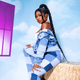 Image for article titled Meg Thee Stallion's Fashion Nova Debut Is a 'Wild Western Moto Speed Chase'—With Some Wild Ass Patterns